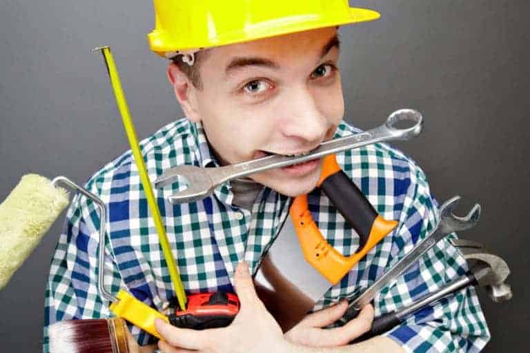 photo of repairman carrying tools to illustrate the need to plan you r website properly
